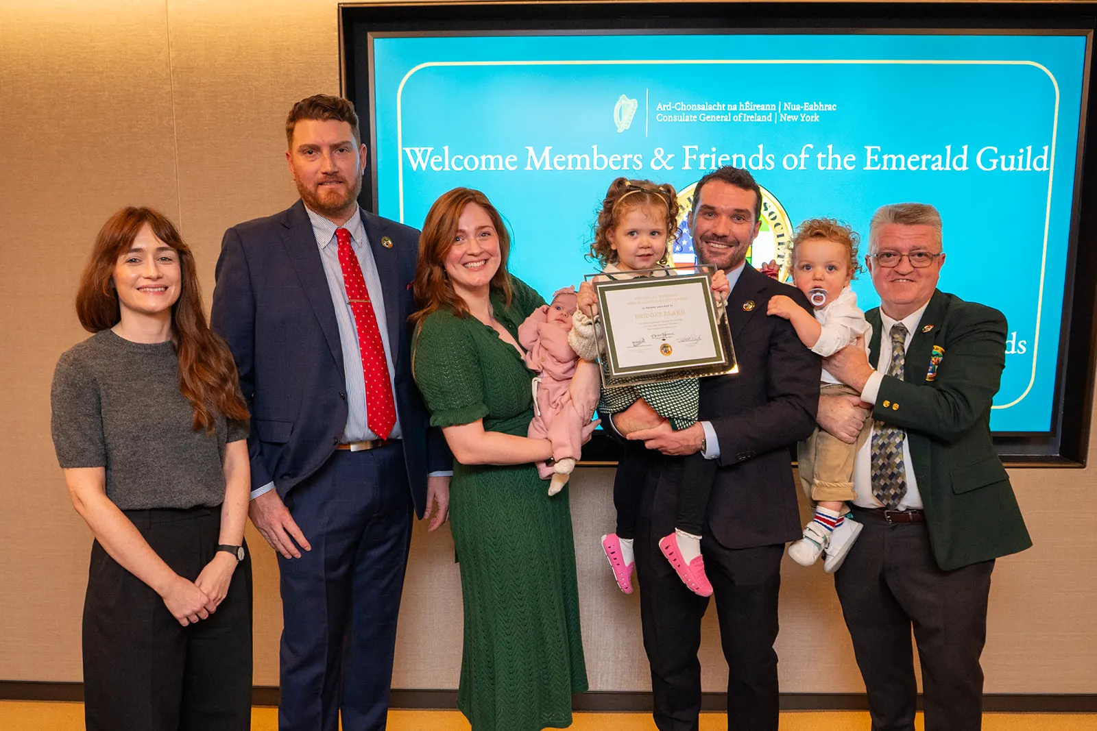 Scholarship recipient and family with Emerald Guild members at the 2026 awards night.